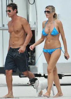 Rita Rusic thrills her fiancé in frilled bikini as she hits 