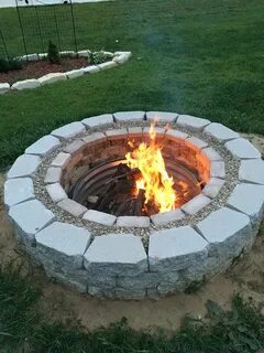 Fire pit made from bricks, grout, gravel, and retaining wall