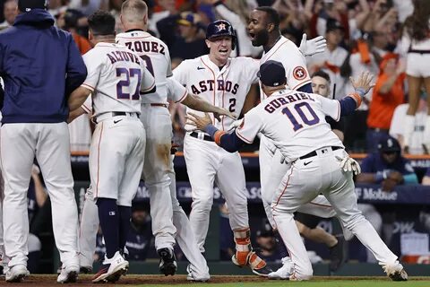 The Astros celebrate after Yordan Alvarez’s walk-off home run in Game 1. 