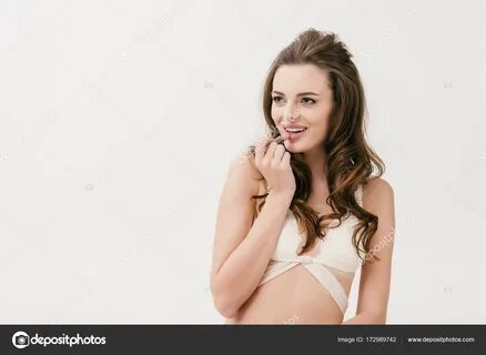 Girl in white lingerie holding lipstick Stock Photo by © VitalikRadko 172989742