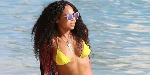 Ashanti Turns Heads On The Beach In A Yellow Bikini