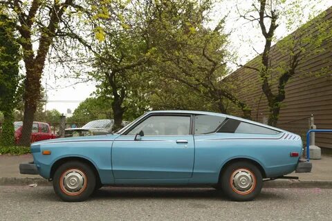 OLD PARKED CARS.: 1977 Datsun B210 fastback.