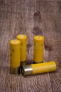 Yellow Shotgun Shells Standing Up on End Stock Photo - Image