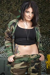 Hot MILF in military uniform uncovering her tempting tattooe