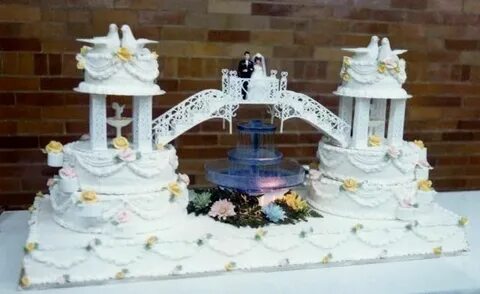 Unique Double Wedding Cake connected by bridge with bride & 