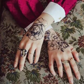 Hand flower tattoo by zihwa_tattooer. These tattoos for wome