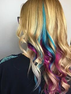 Pink, purple and blue (teal) peekaboo highlights under blond
