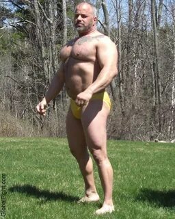 huge bodybuilder beefy strongman men posing flexing