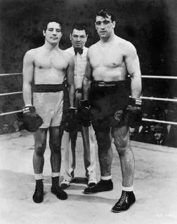 1934: Max Baer (left) vs. Primo Carnera (right) boxed for th