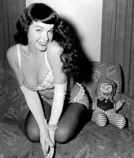 Bettie Page stepping outside to observe