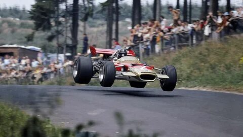 Desktop Wallpaper: Graham Hill Flying The Lotus 49 Racing, F