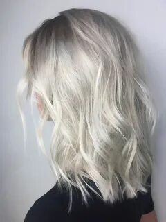 Medium length , platinum ice blonde with shadowed roots and 