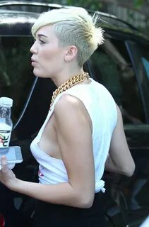 MILEY CYRUS in Ripped Shirt at Whole Foods in Los Angeles - 