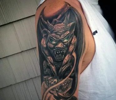 Colored creative designed upper arm tattoo of gargoyle with 