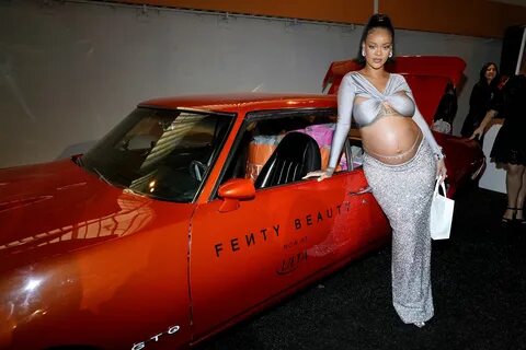 Pregnant Rihanna bares child bump in venturesome two-piece f