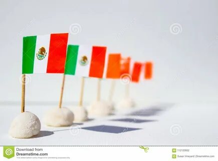 Row of Mini Mexican Flags in a Row with Interesting Shadows - Shallow.