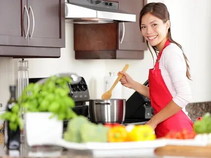 Cooking woman in kitchen - RegistryFinder.com