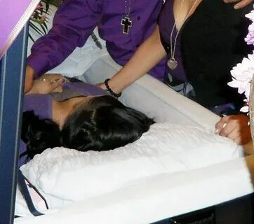 Monica Mapile in her open casket during her funeral.