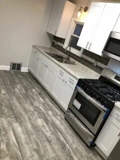 Home decorators Stony oak grey vinyl plank flooring. White s