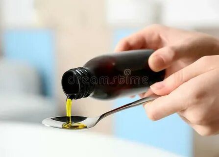 Pouring Syrup Onto Tasty Pancakes with Berries Stock Photo -