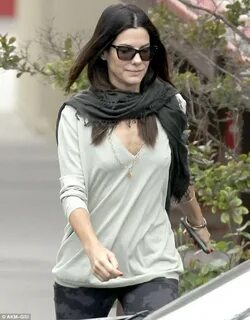 Sandra Bullock is in good spirits as she takes son Louis to 