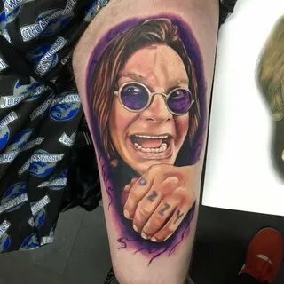 Ozzy Osbourne portrait tattoo on the left thigh.