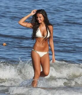 Michelle Keegan busting out in white bikini on the beach in 
