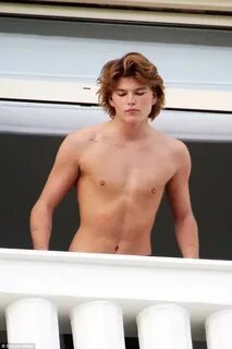 Shirtless Jordan Barrett flaunts his taut torso in Cannes Ex