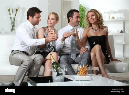 Friends drinking champagne Stock Photo - Alamy