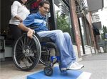 Man with disability building free wheelchair ramps for Montr
