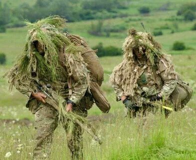 Soldiers of 2 Rifles on exercise on Salisbury plain. Sniper 