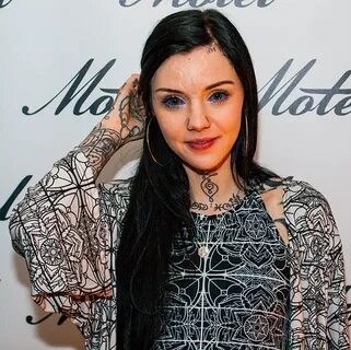 Grace Neutral has her belly button cut off and blue ink inje