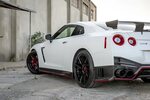 Eye-Catching Red Accents on Custom White Nissan GT-R - CARiD