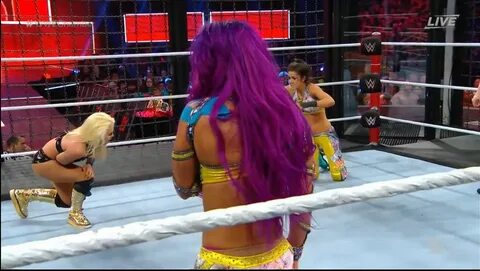 Slight Sasha Banks pink thong peek inside Elimination Chambe