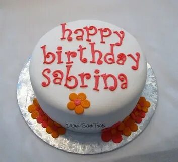 Sabrina's birthday cake covered in fondant, with bright or. 