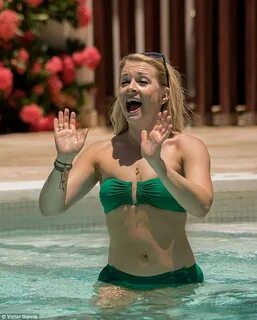 Bikini-clad Melissa Joan Hart soaks in some rays and has a f