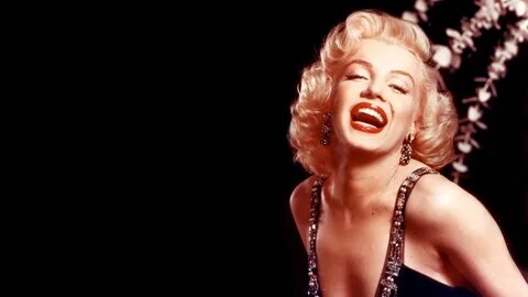 Smiley Marilyn Monroe In Black Background Wearing Black Dres