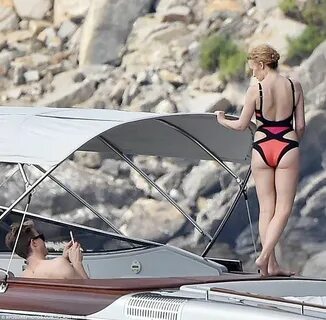 Kylie Minogue looks red hot in sexy swimsuit on Italian holi