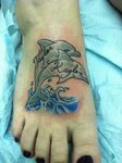 Cute little dolphin tattoo that says my name!!!! Foot tattoo