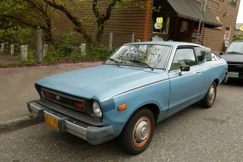 OLD PARKED CARS.: 1977 Datsun B210 fastback.