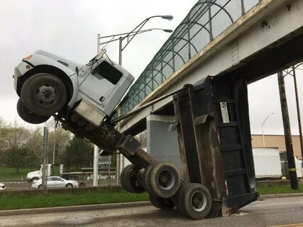 Driver dies of injuries from dump truck crash into footbridg