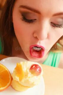 Woman Eating Delicious Sweet Cake. Gluttony. Stock Image - I