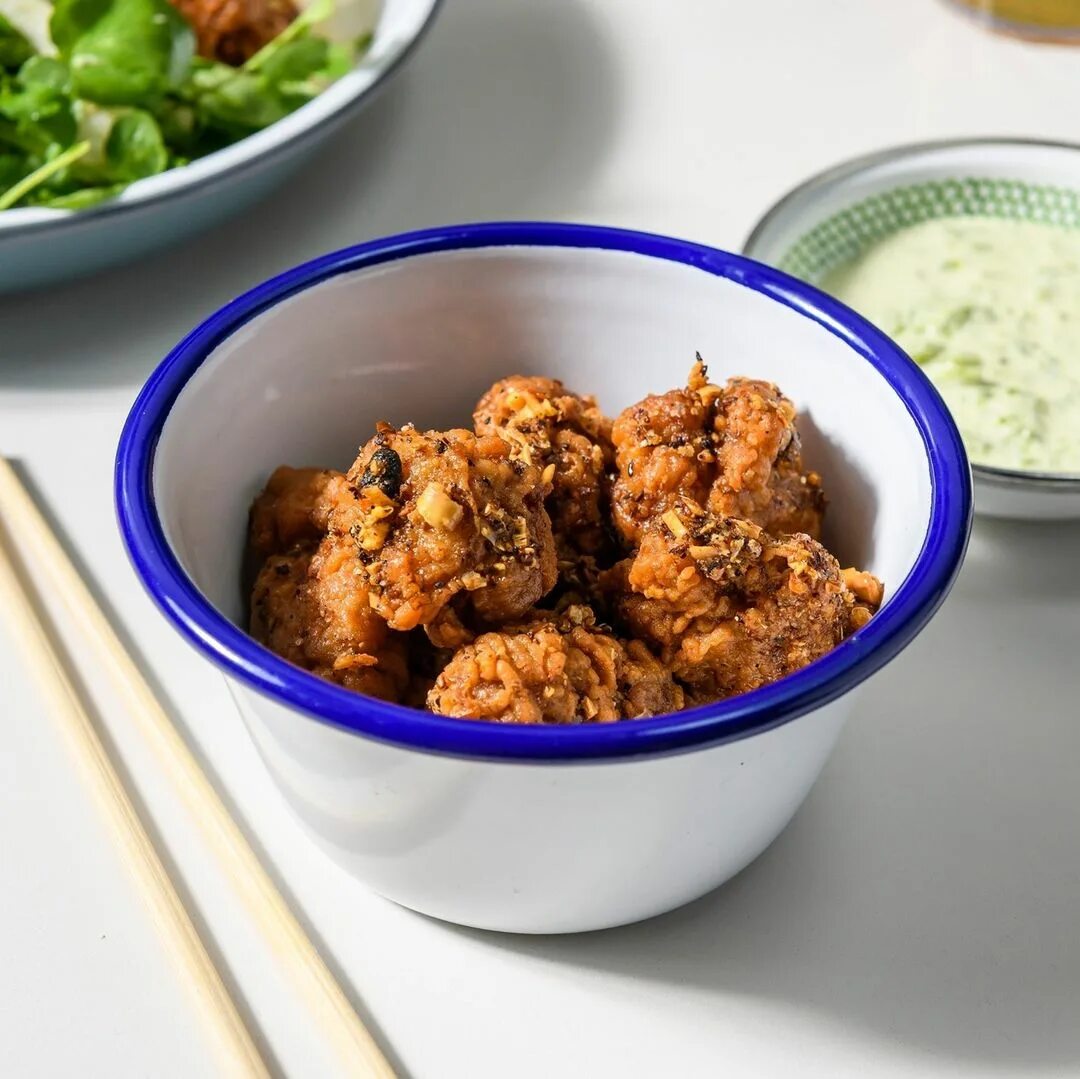 Our side of Chili Crisp Chicken and Scallion Mayo certainly packs a punch. ...