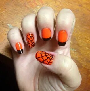 Halloween nail art Neon orange with black tips and a few spi