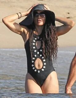 That's MY man! Proud wife Lisa Bonet, 43, enjoys the surf in