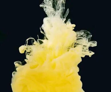 Yellow-white Smoke of Acrylic Paint Swirling in Liquid, Isol