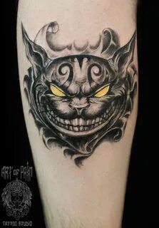 Татуировка женская графика на предплечье чеширский кот Art o
