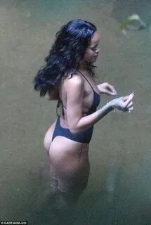 Rihanna poses for bikini selfies... before changing into a V