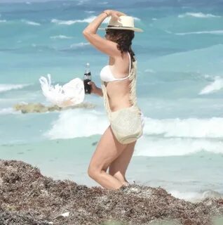 LUANN DE LESSEPS in a White Bikini at a Beach in Tulum 03/17