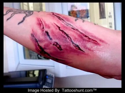29 Unique Ripped Skin Tattoo Art Images Gallery